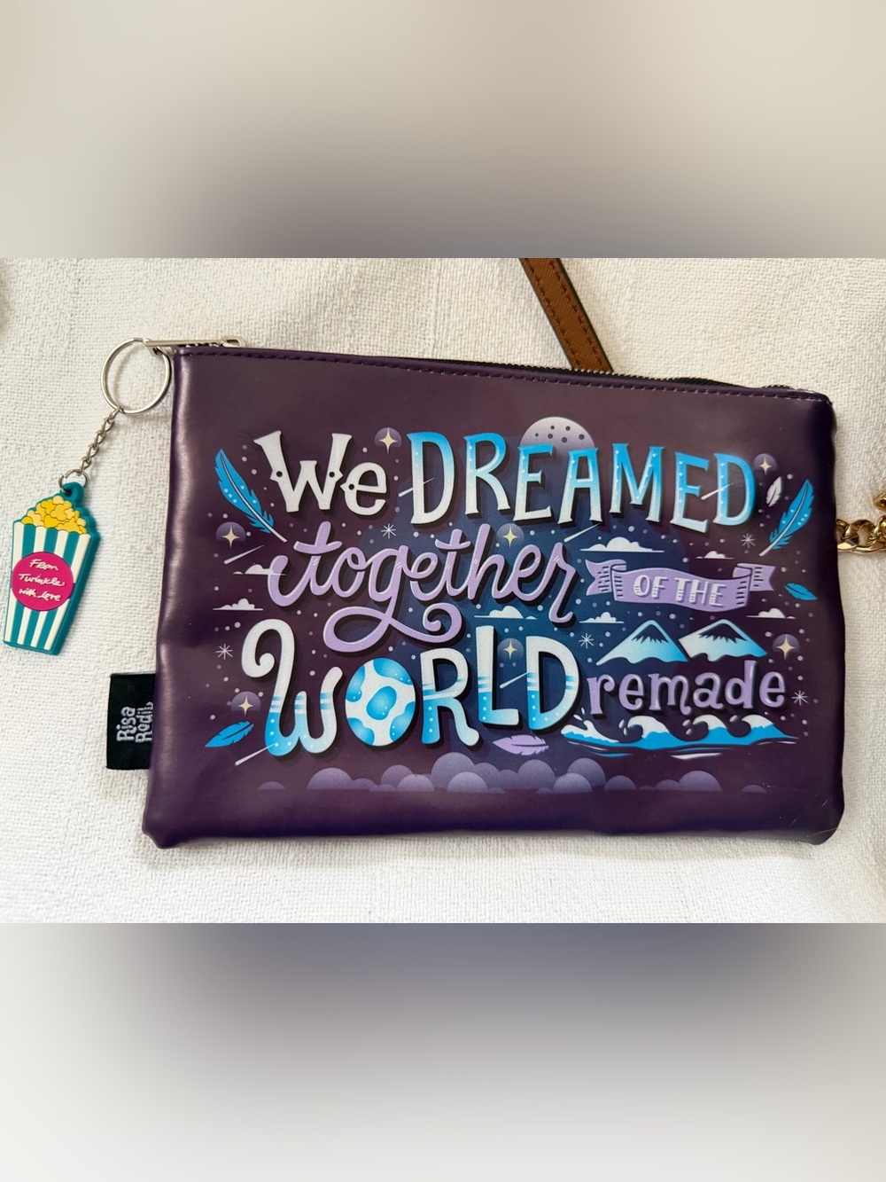 We Dream Together World Purple Graphic Wristlet